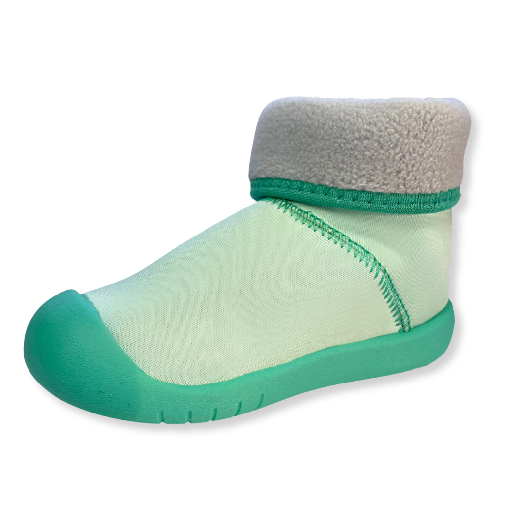 Winter barefoot shoes for toddlers, warm soft sole wellies for pre walkers, still shot on clear background. showing a warm, cosy, fleece lining